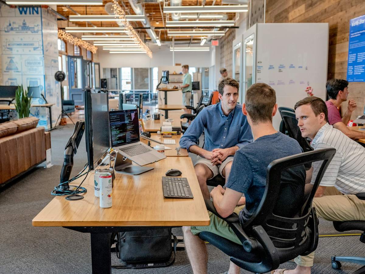 A startup engineering floor with teams working across desks